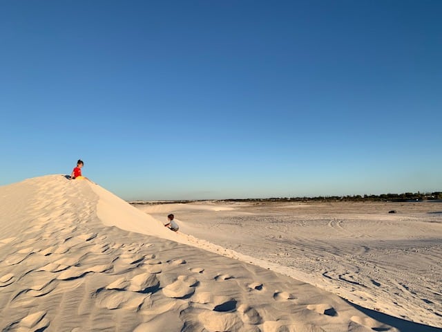 Small children on sand dune in Lancelin
